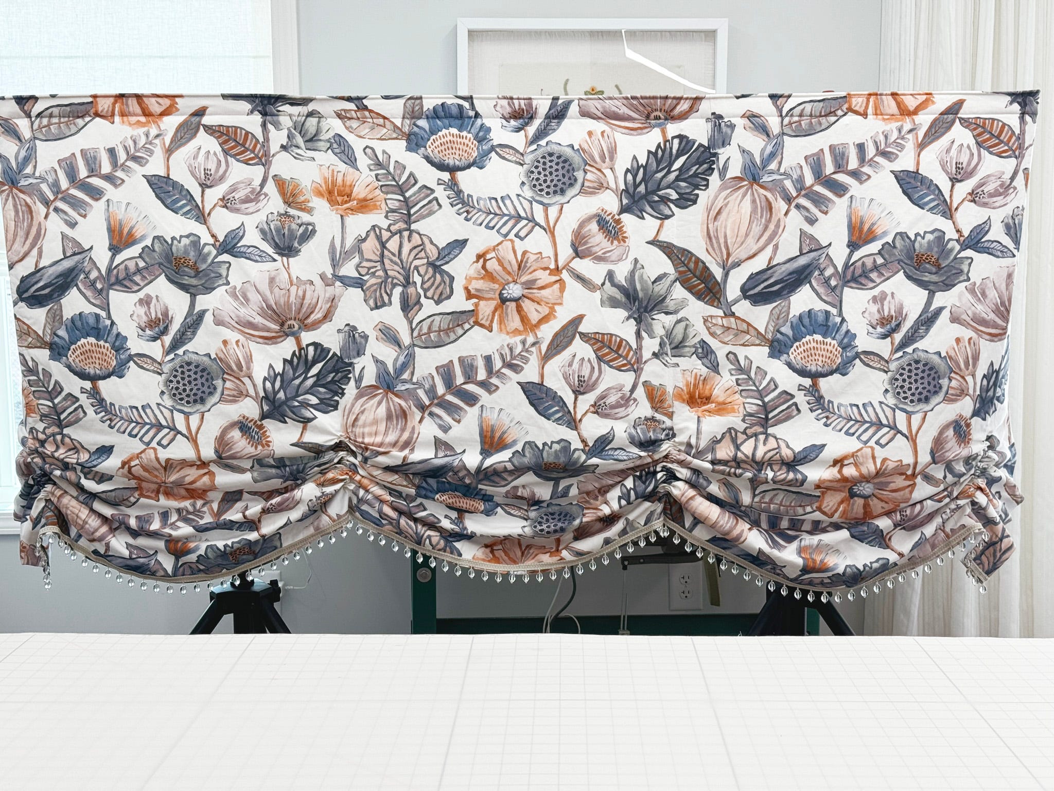 Valance with scalloped gathering and glass bead trim detail.