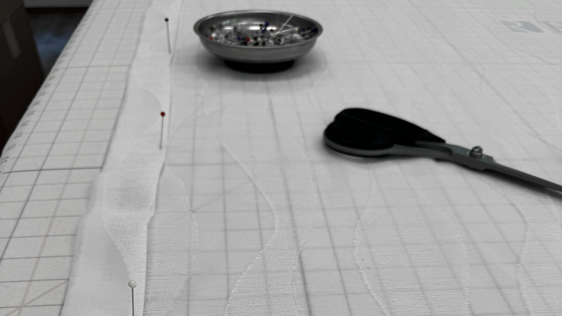Finishing the side hems of the fabric.